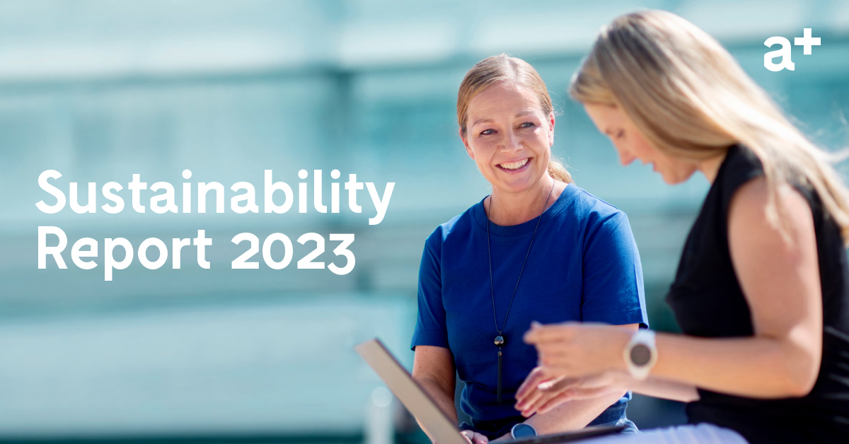 two women sitting outdoors