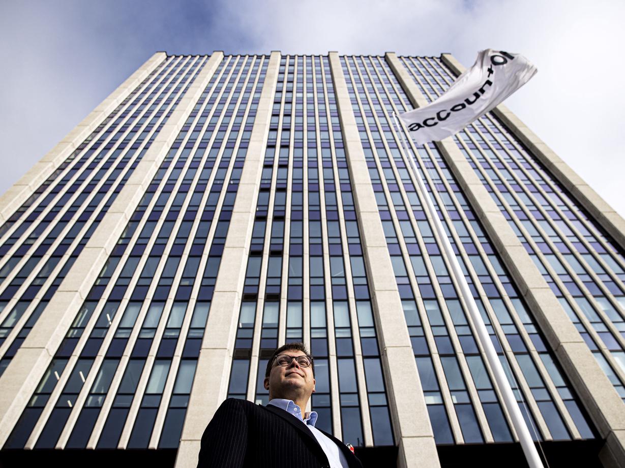 man in front of high building
