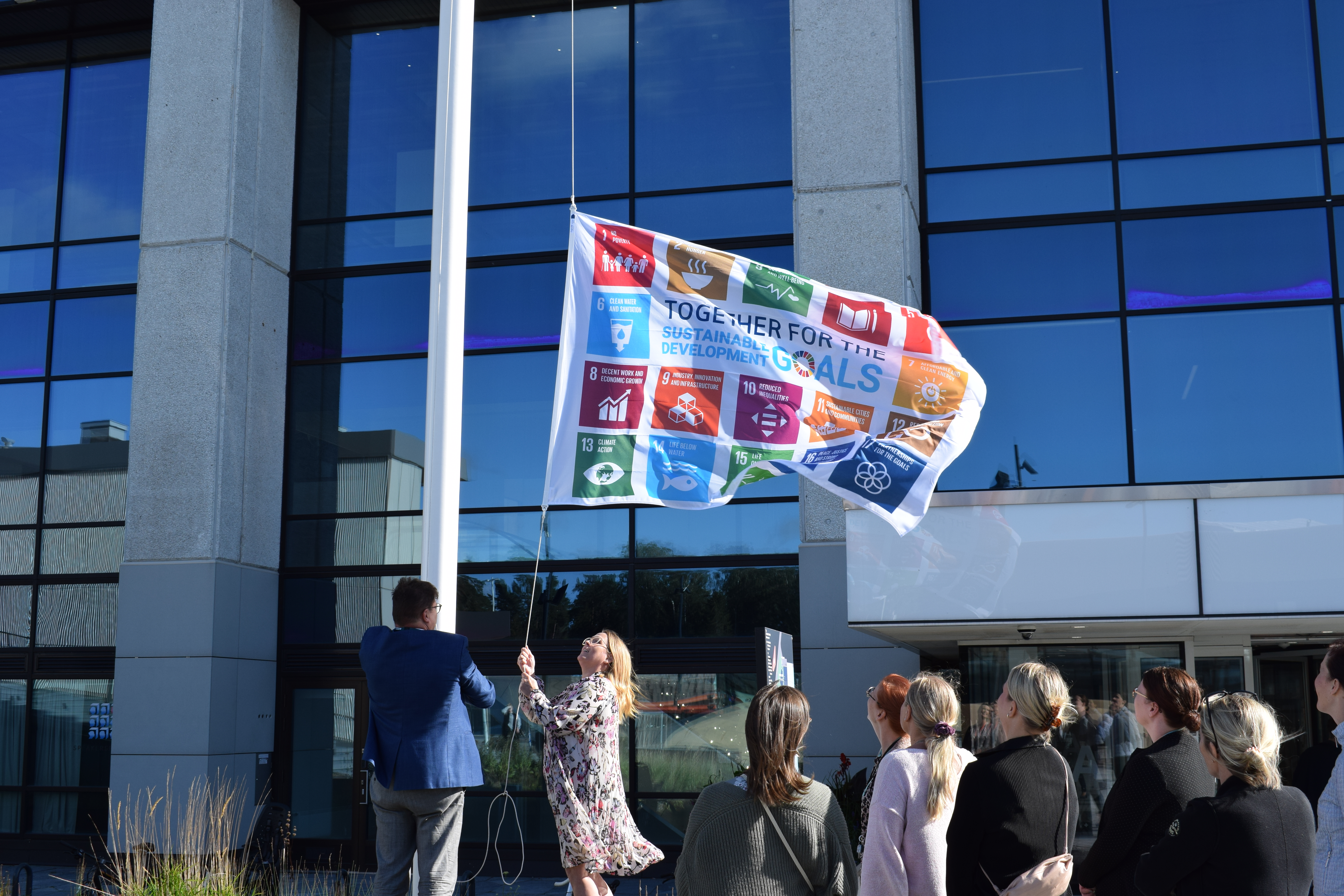 People raising a flag